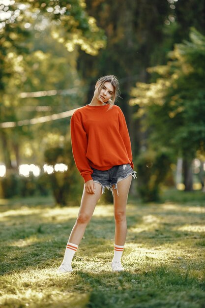 Girl standing in a summer park