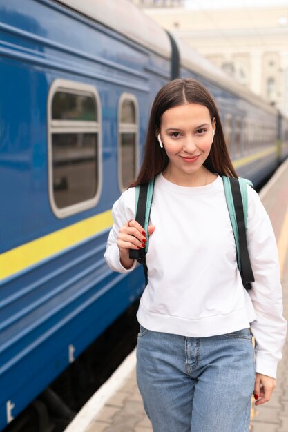 Girl standing next to the train front view