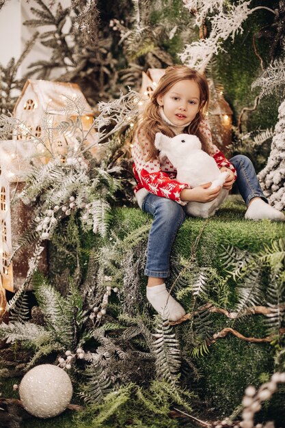 Girl standing on the upper level of Christmas decoration