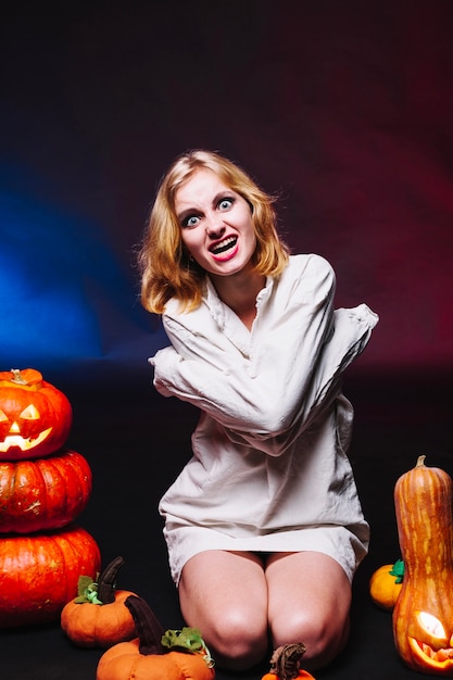 Girl in straitjacket looking at camera