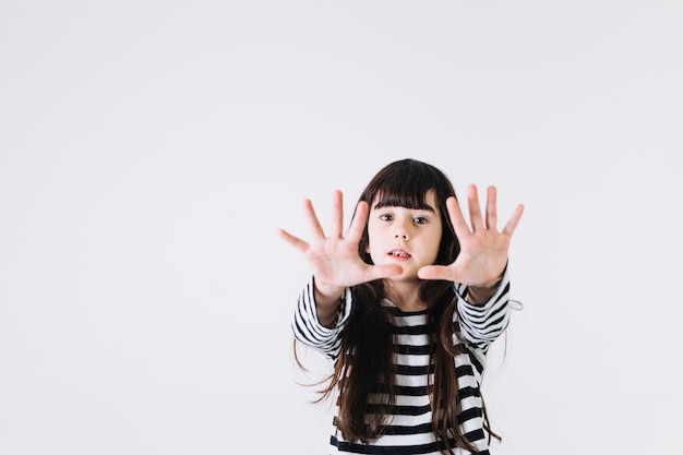 Free photo girl stretching hands towards camera