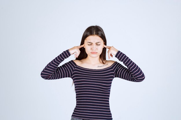 Girl in striped shirt thinking and brainstorming. 