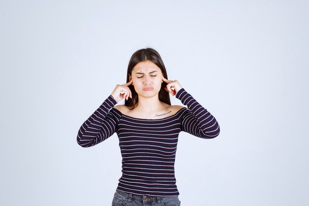 Girl in striped shirt thinking and brainstorming.