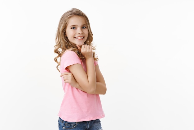 Girl student kid, smiling silly laughing, posing delighted and cheering, turn camera playful upbeat expression