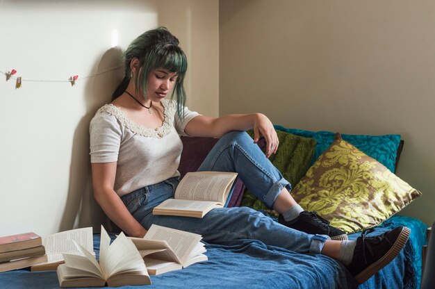 Girl studying on bed