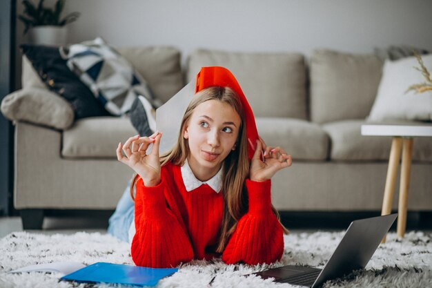 Girl studying at home on the computer