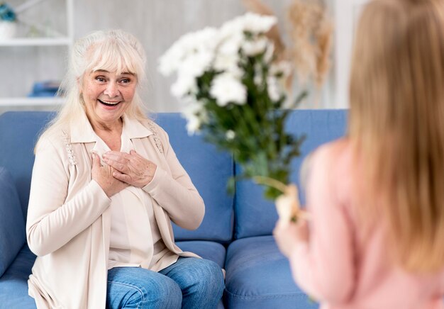 Girl surprising grandma