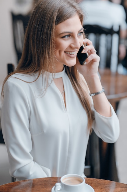 Girl talking on the phone while smiling