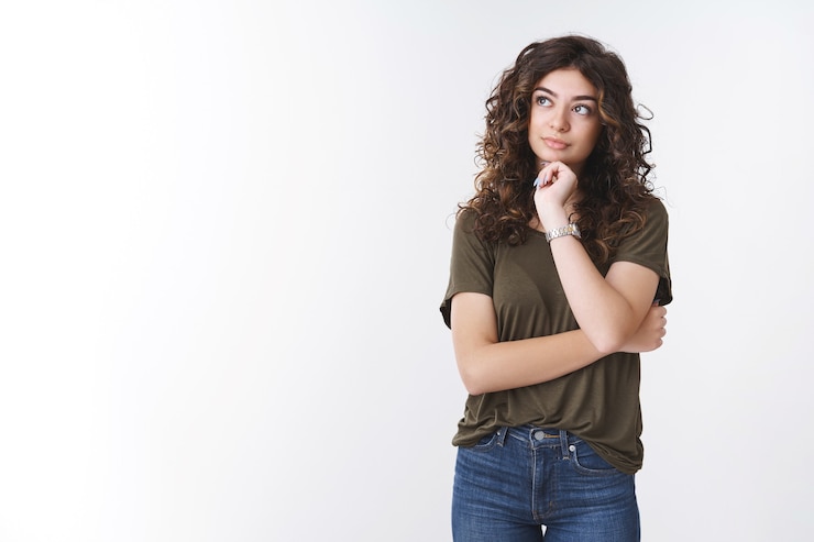 Free Photo girl thinking how manage time better, making plans grocery list mind, look up thoughtful touch jawline, dreaming have important decision, make choice, standing white background unsure