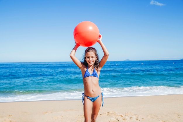 Free photo girl throwing ball