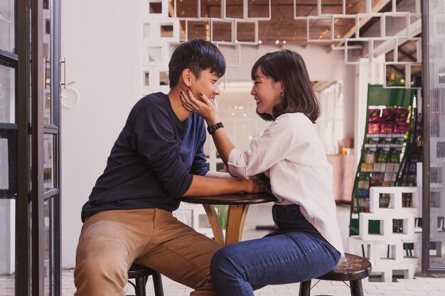 Girl touching her boy's face