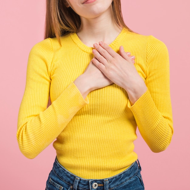 Free photo girl touching her heart