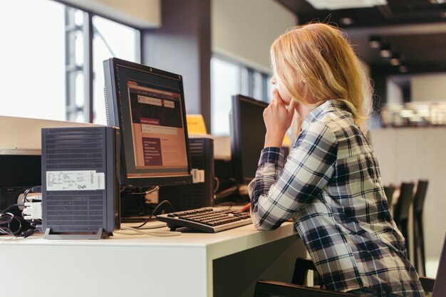 Girl using computer in college