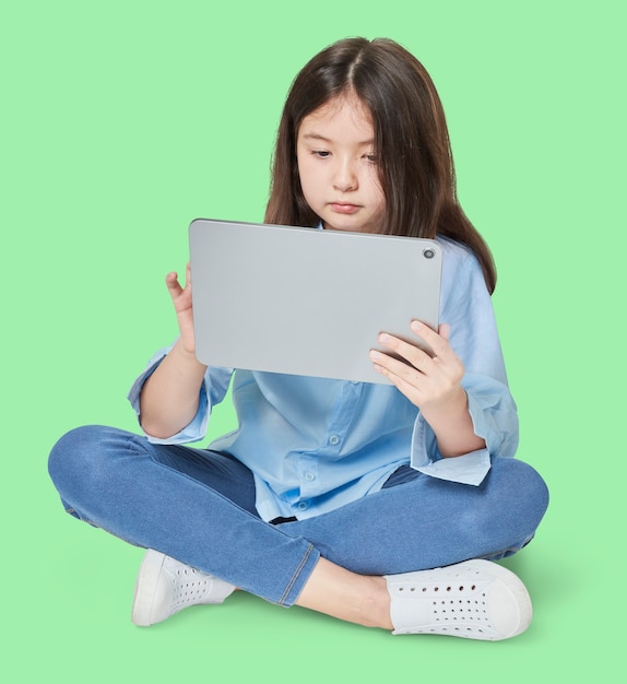 Girl using digital tablet