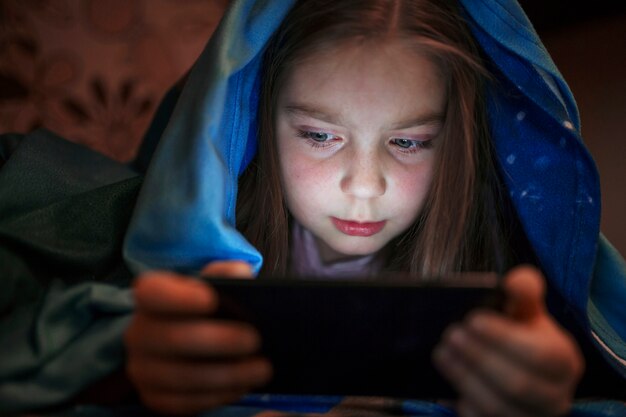 Girl using smartphone in evening