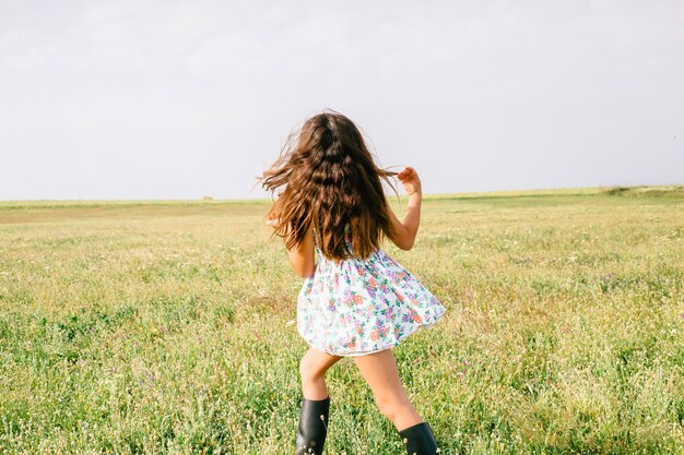 Girl walking in field