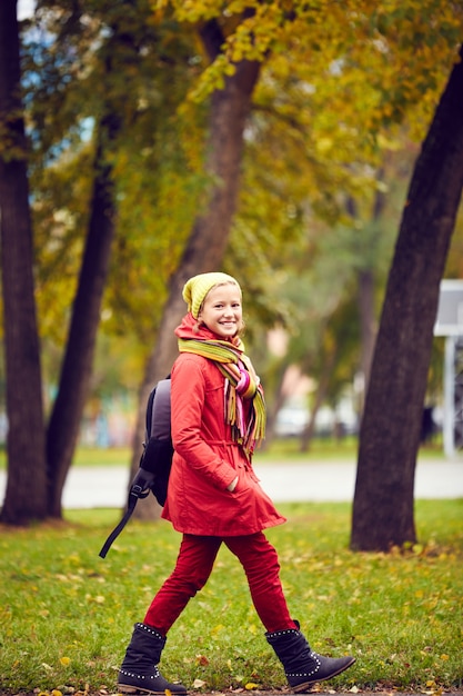 Girl walking through a park