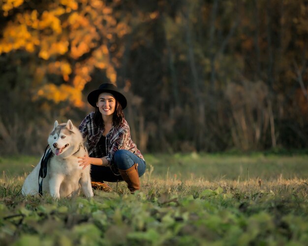 girl walks with husky