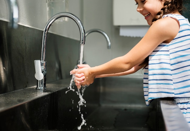 Girl washing her hands