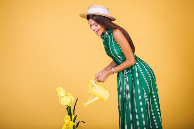 Free photo girl watering flowers