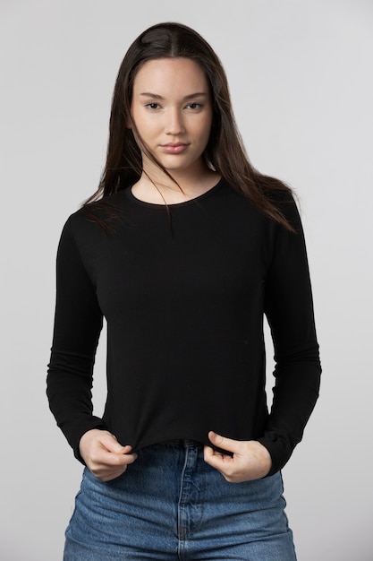 Girl wearing black t-shirt posing in studio