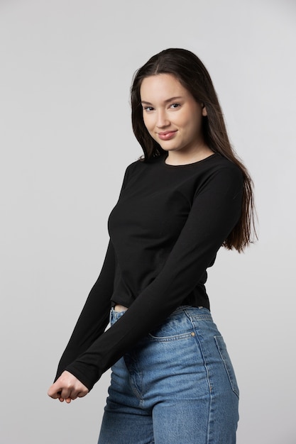 Girl wearing black t-shirt posing in studio