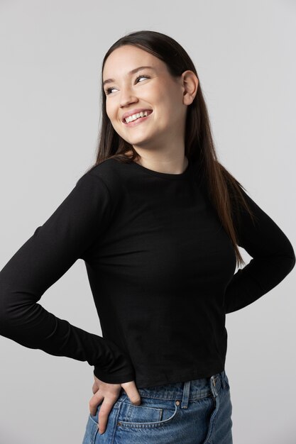 Girl wearing black t-shirt posing in studio