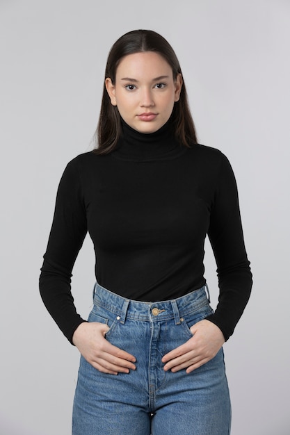 Girl wearing black turtleneck posing in studio