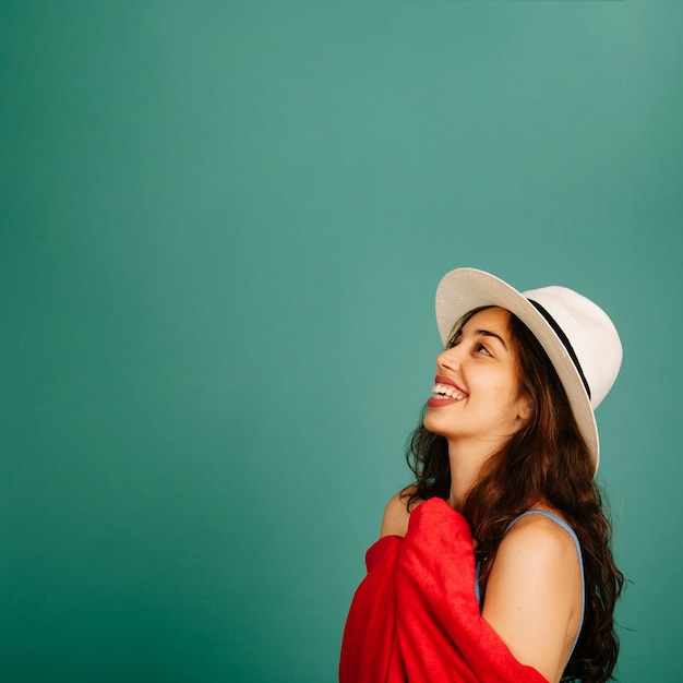 Girl wearing hat and towel side view