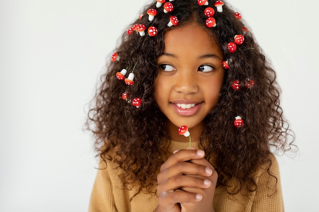 Girl wearing little mushrooms in hair