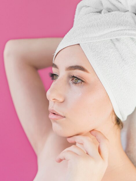 Girl wearing a towel and looking away