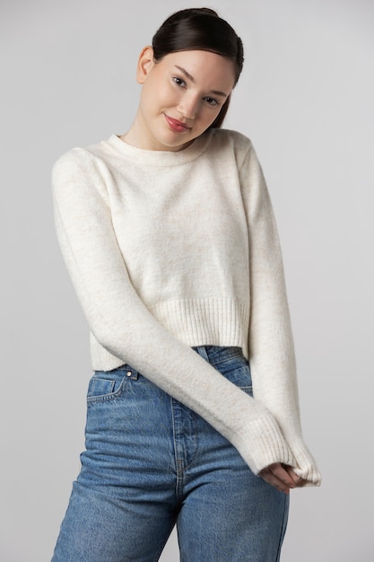 Girl wearing white t-shirt posing in studio