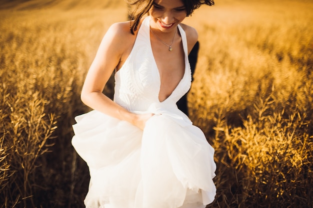 "Girl in white dress running in field"