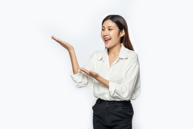 The girl in a white shirt and the open hand sign on the side