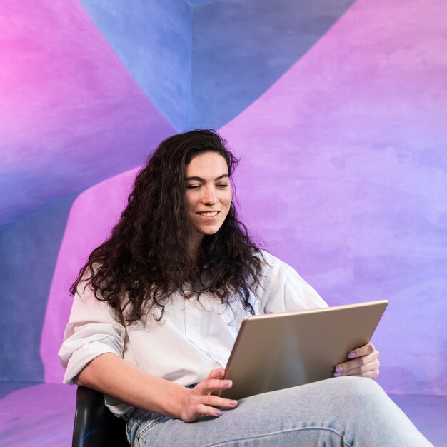 Girl with beautiful hair working on laptop