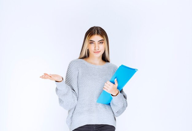 Girl with a blue folder completed tasks on time and feeling cool.