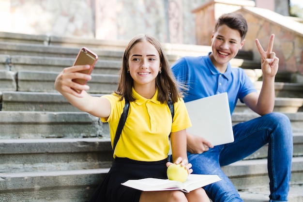 Girl with boy making selfie