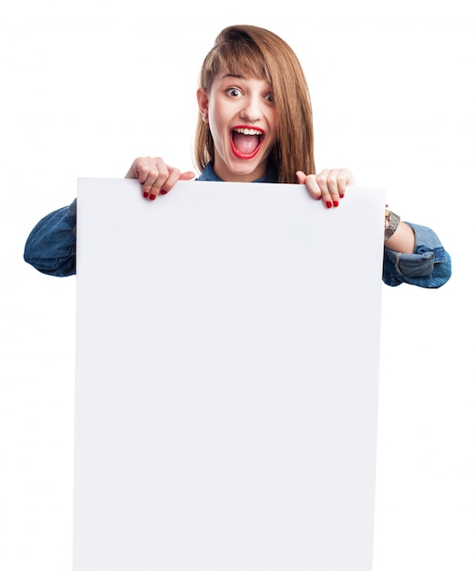 Girl with casual hairstyle holding a white sign