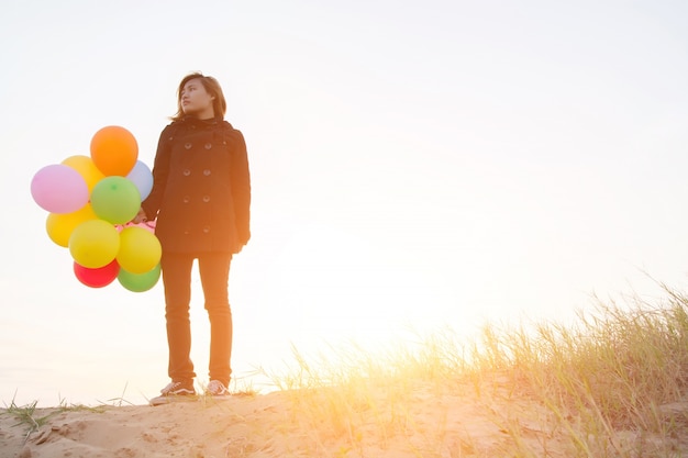 Free photo girl with colorful balloon