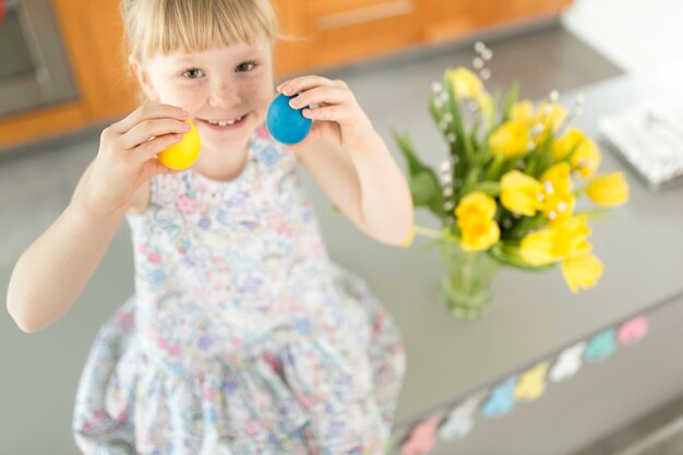 Girl with colorful Easter eggs