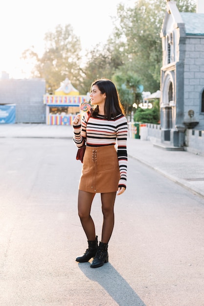 Girl with colorful lollipop