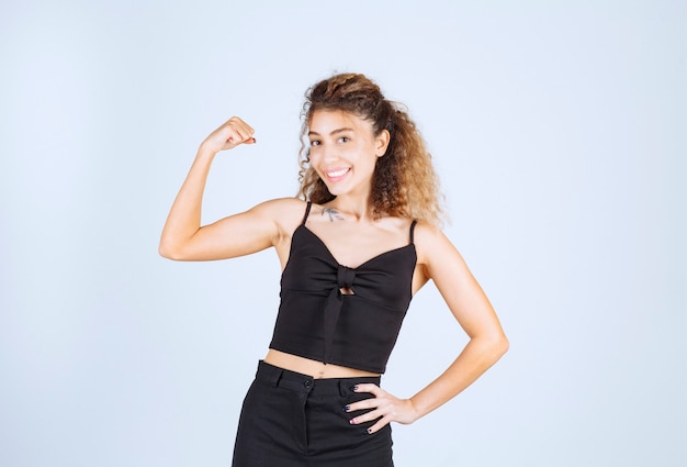 Free photo girl with curly hairs feeling powerful.