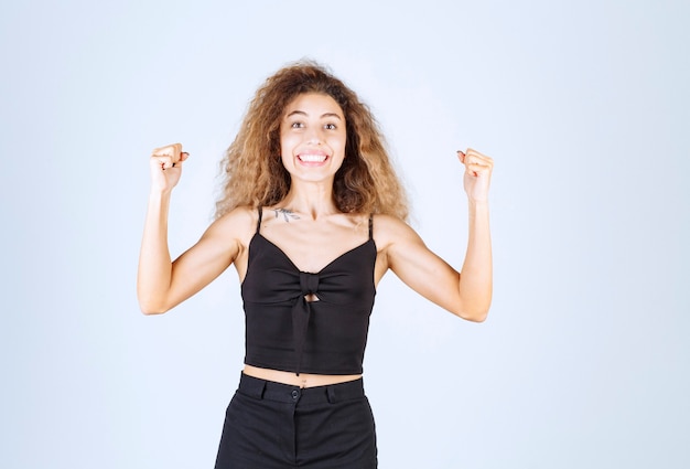 Free photo girl with curly hairs feeling powerful.