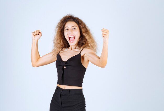 Free photo girl with curly hairs feeling powerful.