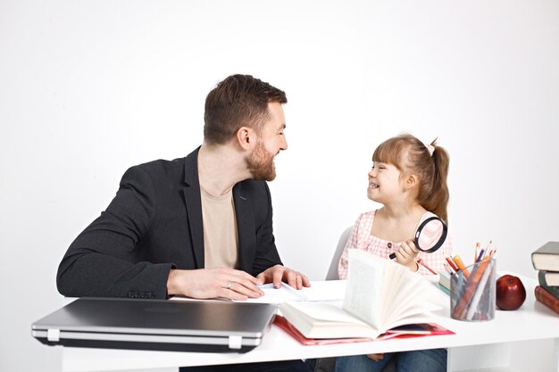 Girl with Down syndrome studying with her teacher at home