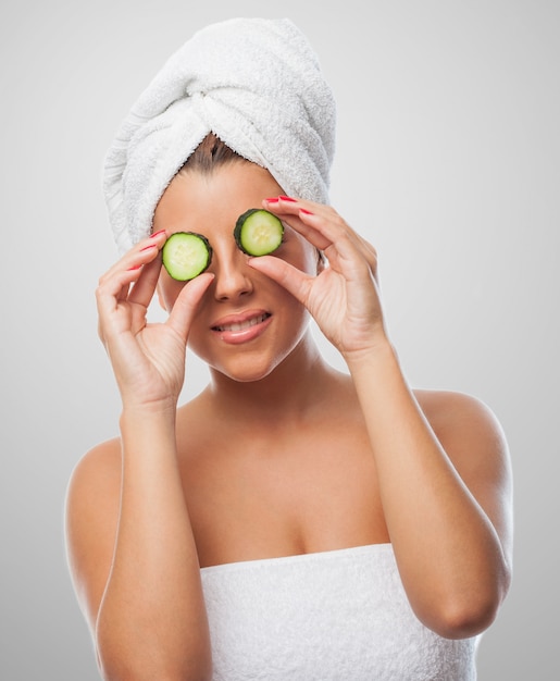 girl with eye mask of cucumbers