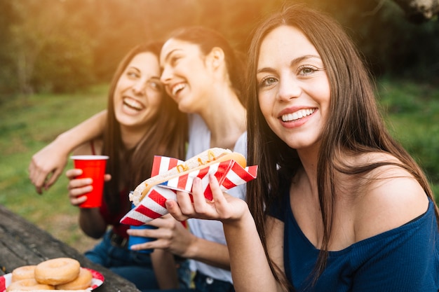 Girl with friends resting in park