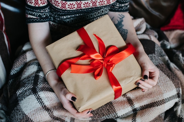 Girl with a gift on her lap