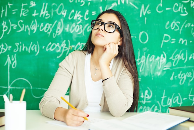 Girl with glasses in class