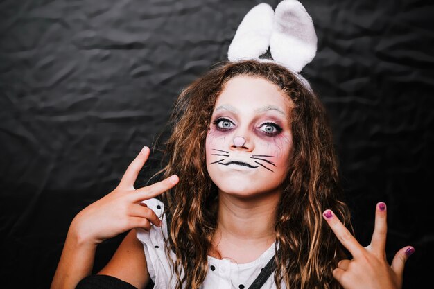 Girl with hare face paint posing